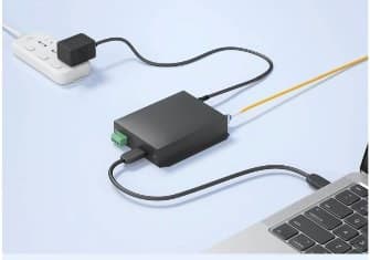 The control box plugged into a laptop and power
